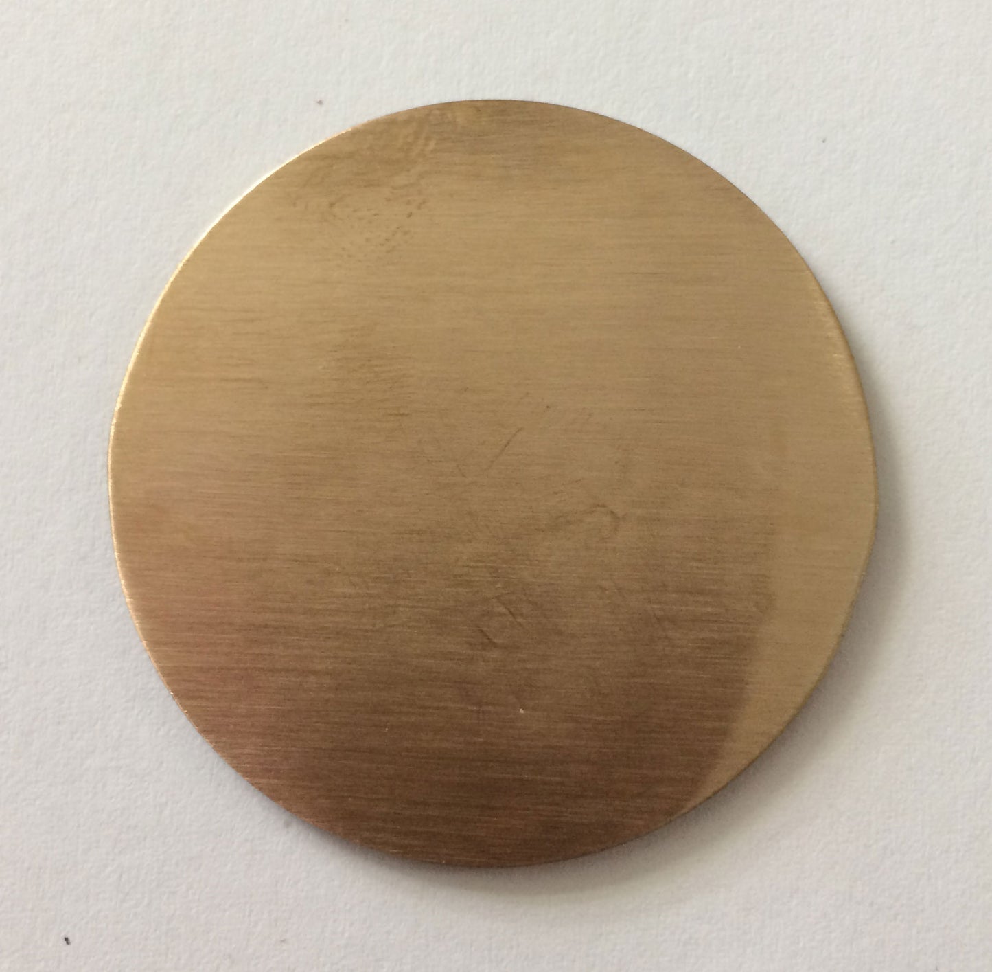 Back of bronze Golf Marker