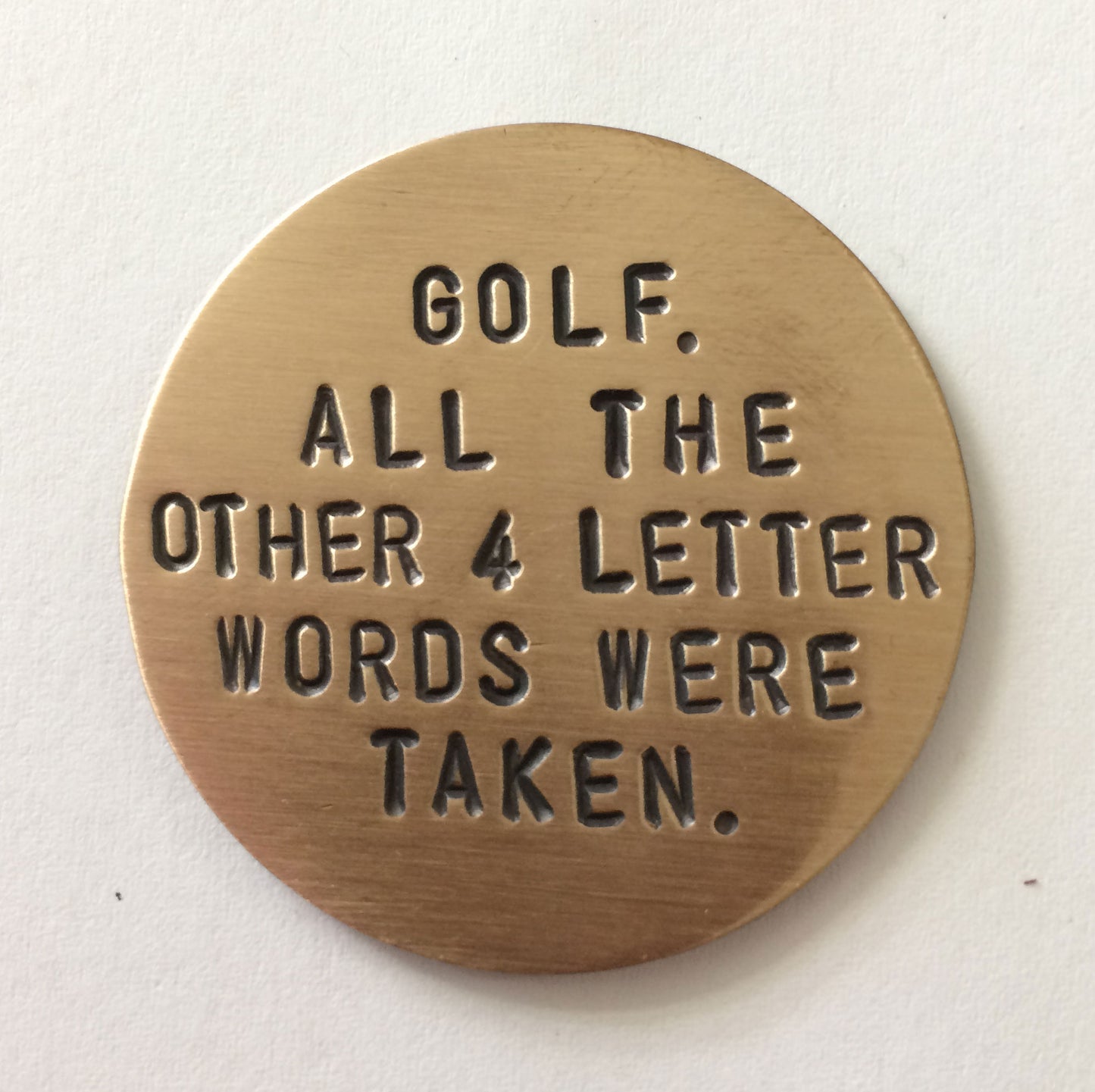 Front of bronze Golf Marker