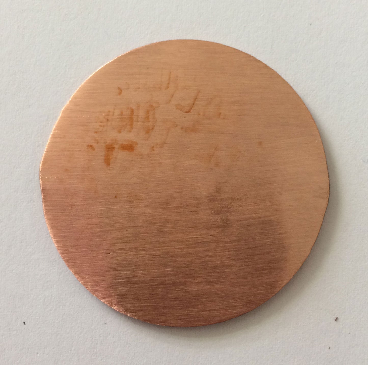 Back of copper Golf Marker