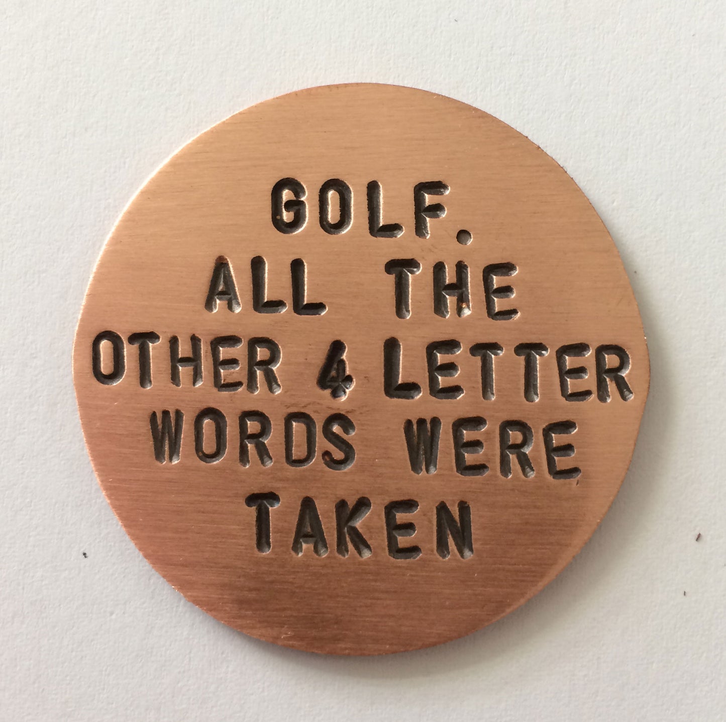 Front of copper Golf Marker