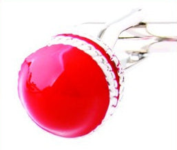 Cricket ball cufflinks close-up