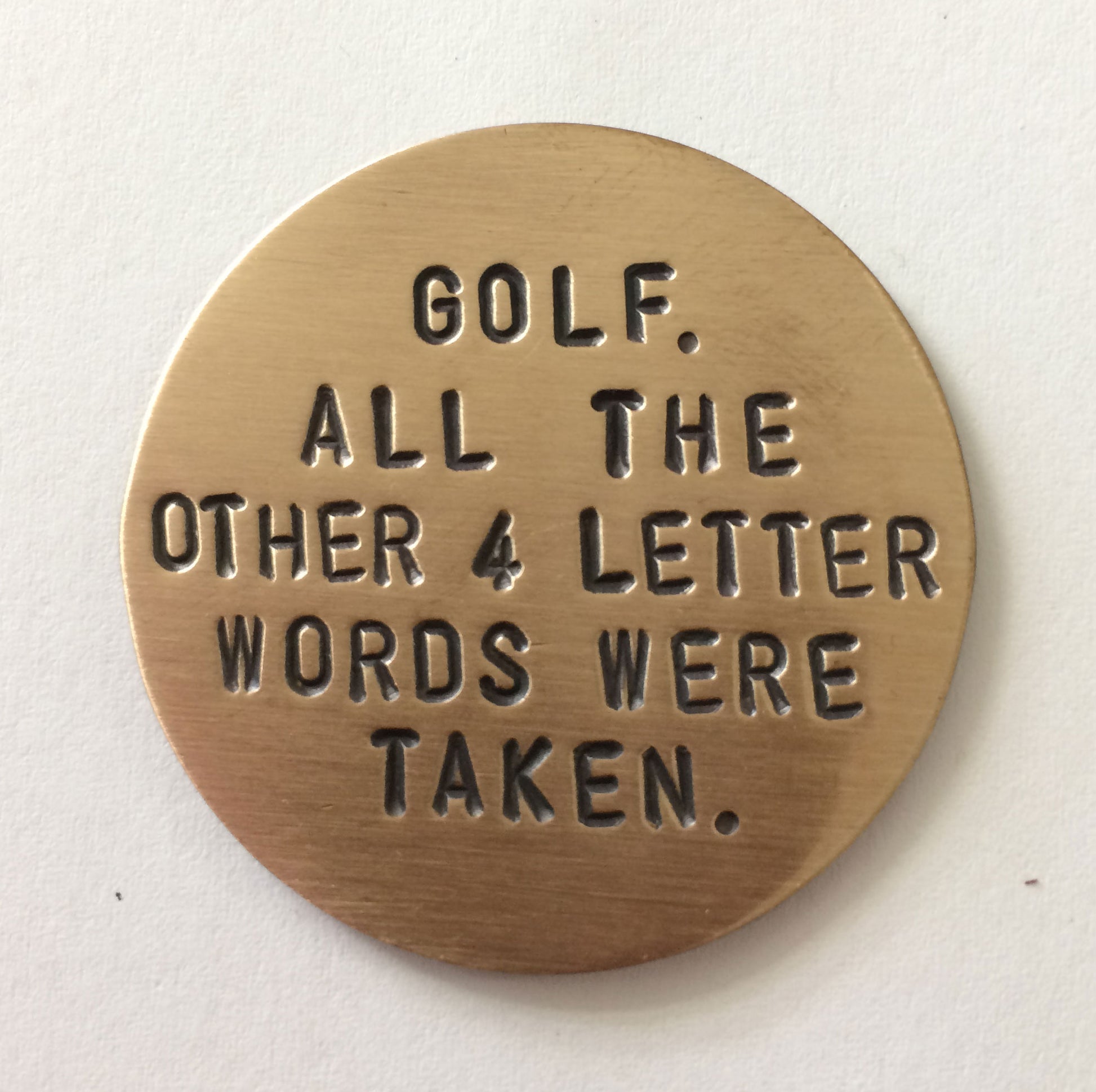 Front of bronze Golf Marker