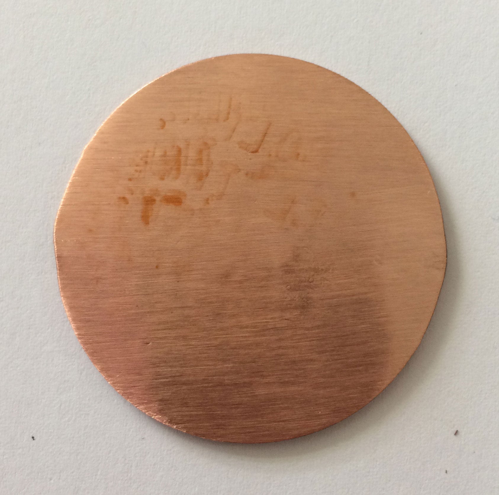 Back of copper Golf Marker